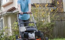 Teenager boy mowing lawn – The benefits of giving your kids chores 